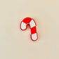 striped holiday clicker with segmented tiles for repeatable tactile feedback
