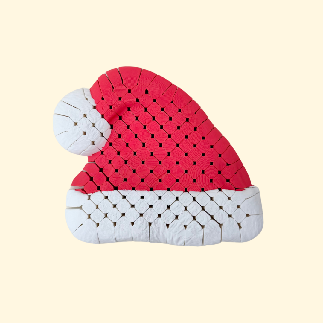 Textured flexible Santa hat with raised knit effect, large 16 cm desk fidget for sensory use, quiet movement.
