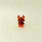 Handheld stim toy with a bold colour blend and creature features
