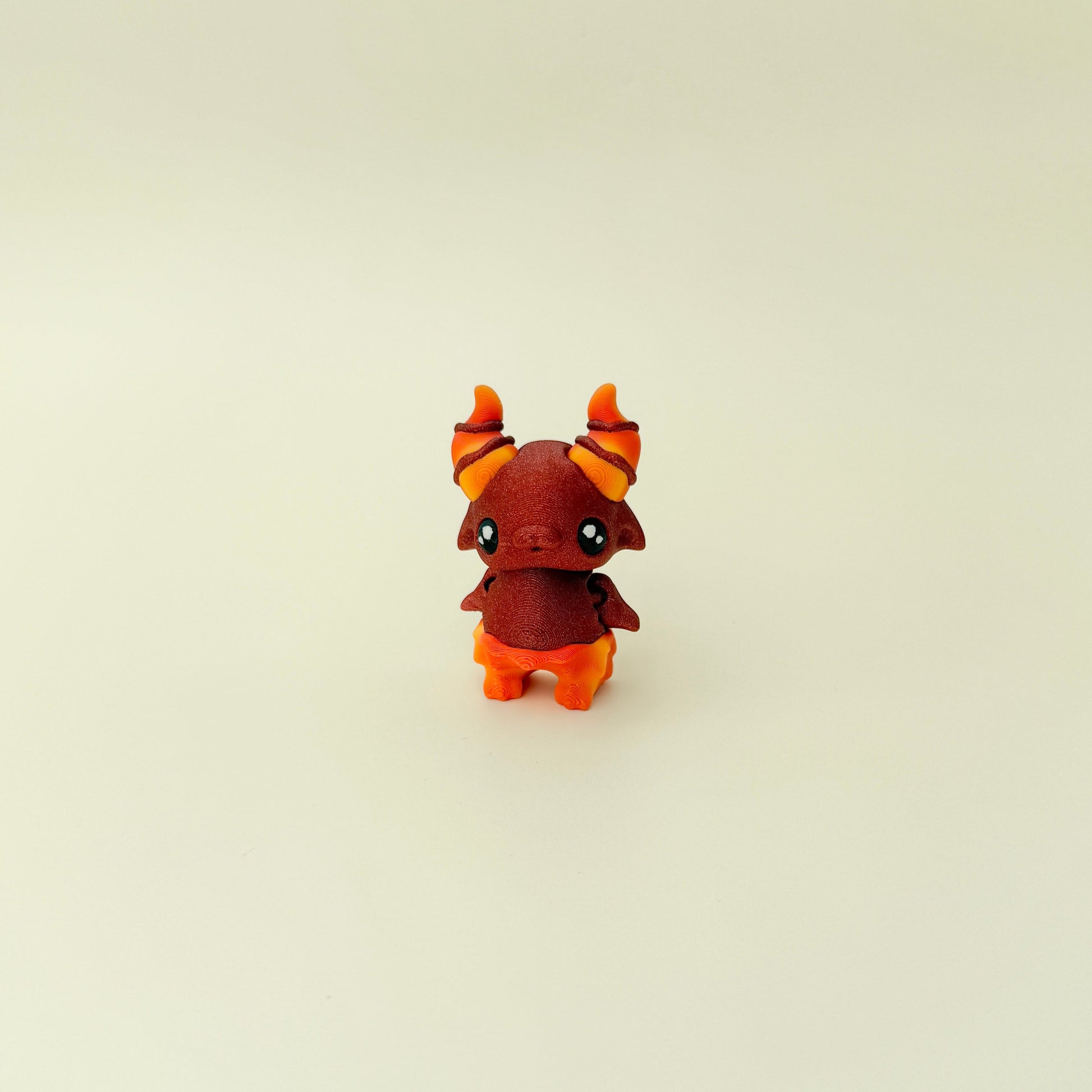 Handheld stim toy with a bold colour blend and creature features
