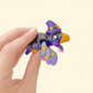 Mini crow whose wings wrap around a finger like a tiny pet.
