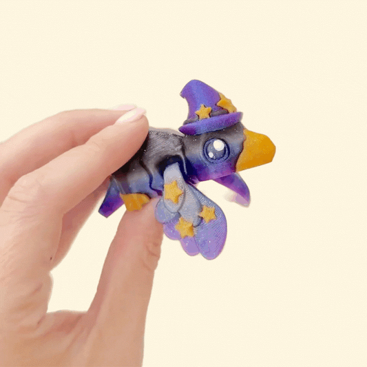 Mini crow whose wings wrap around a finger like a tiny pet.
