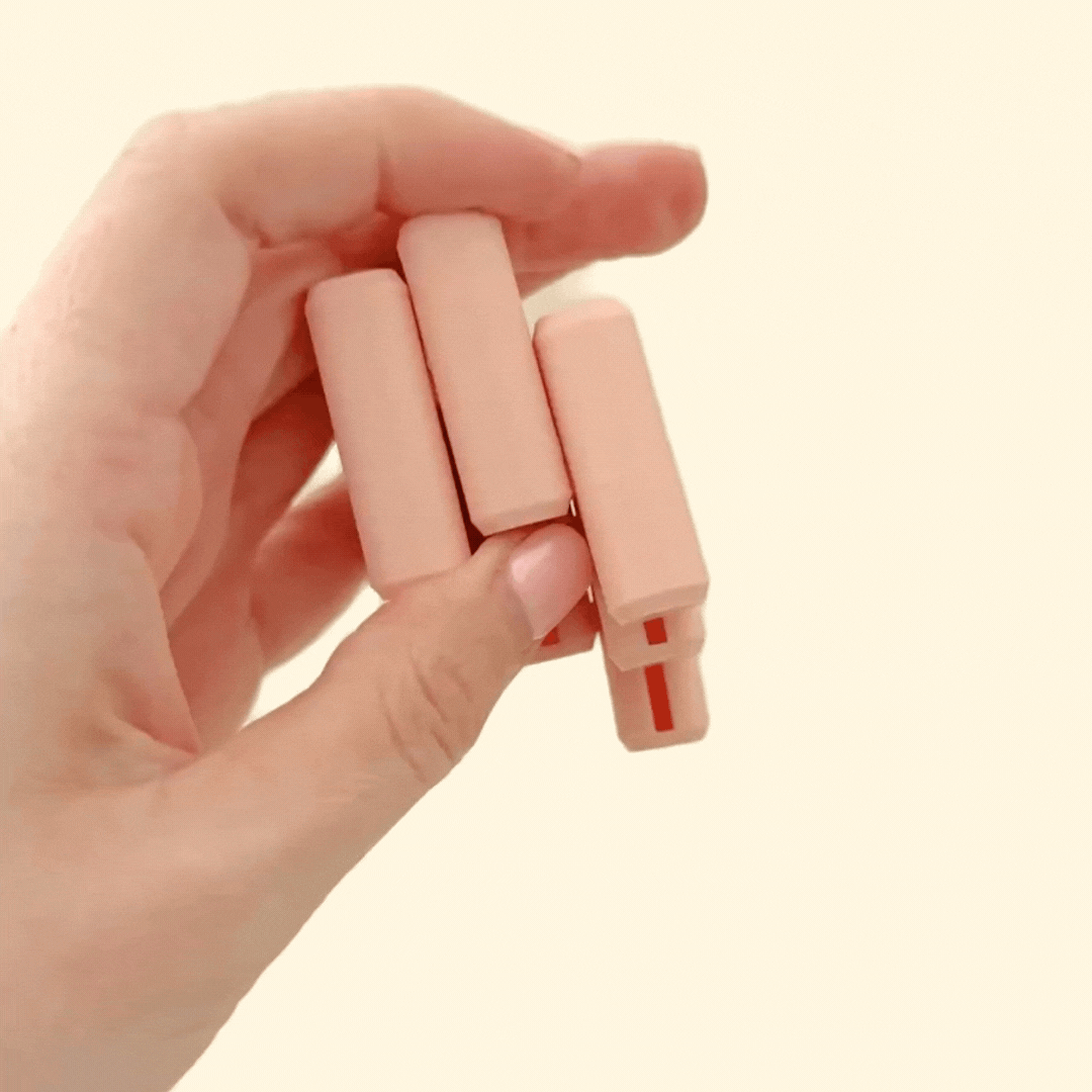 A peachy-nude FlexiBlock fidget toy with rounded edges, designed for sensory play.