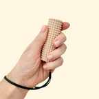 A firm-textured sensory roller designed for deep pressure stimulation and fidget relief.
