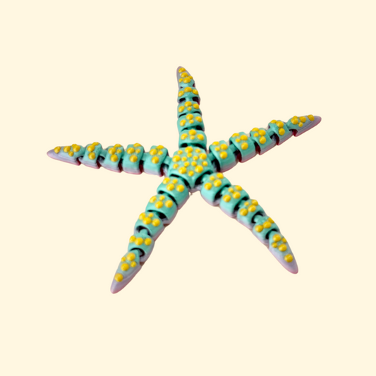 Rainbow-coloured starfish sensory toy, gently textured with smooth articulated segments for calming fidgeting.