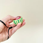 cute fruit shaped clicker fidget with removable wrist strap for on the go
