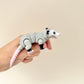 A fidget possum toy with a fully flexible tail that can curl or straighten, perfect for sensory play and display.