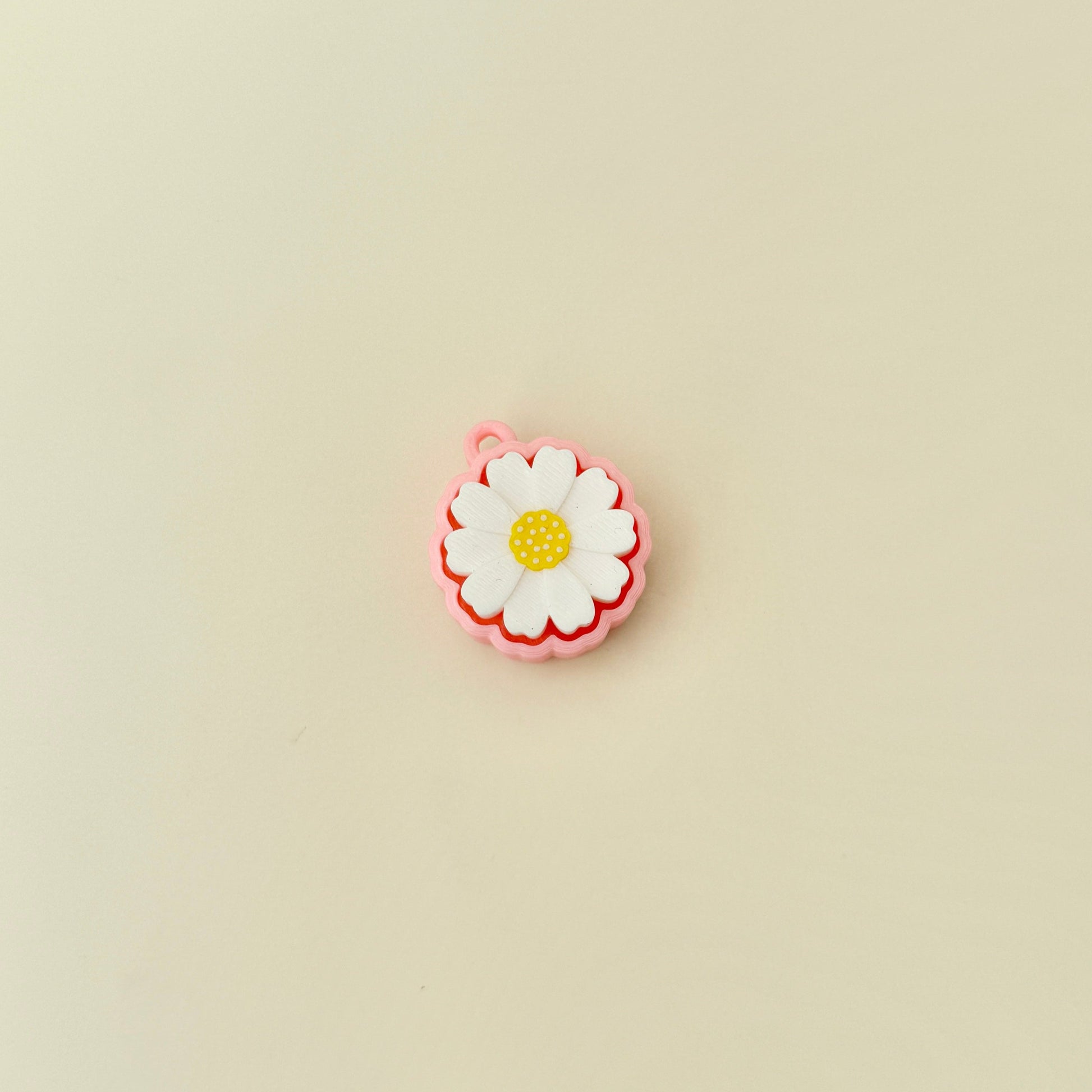 Lightweight clicker fidget toy shaped like a daisy for portable sensory play.