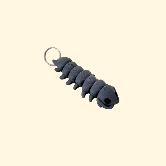Articulated centipede lanyard accessory with multiple segments for busy hands, grounding, and sensory regulation.

