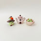 Teapot clicker that pairs with our frog and cottage-themed fidgets for collectors.
