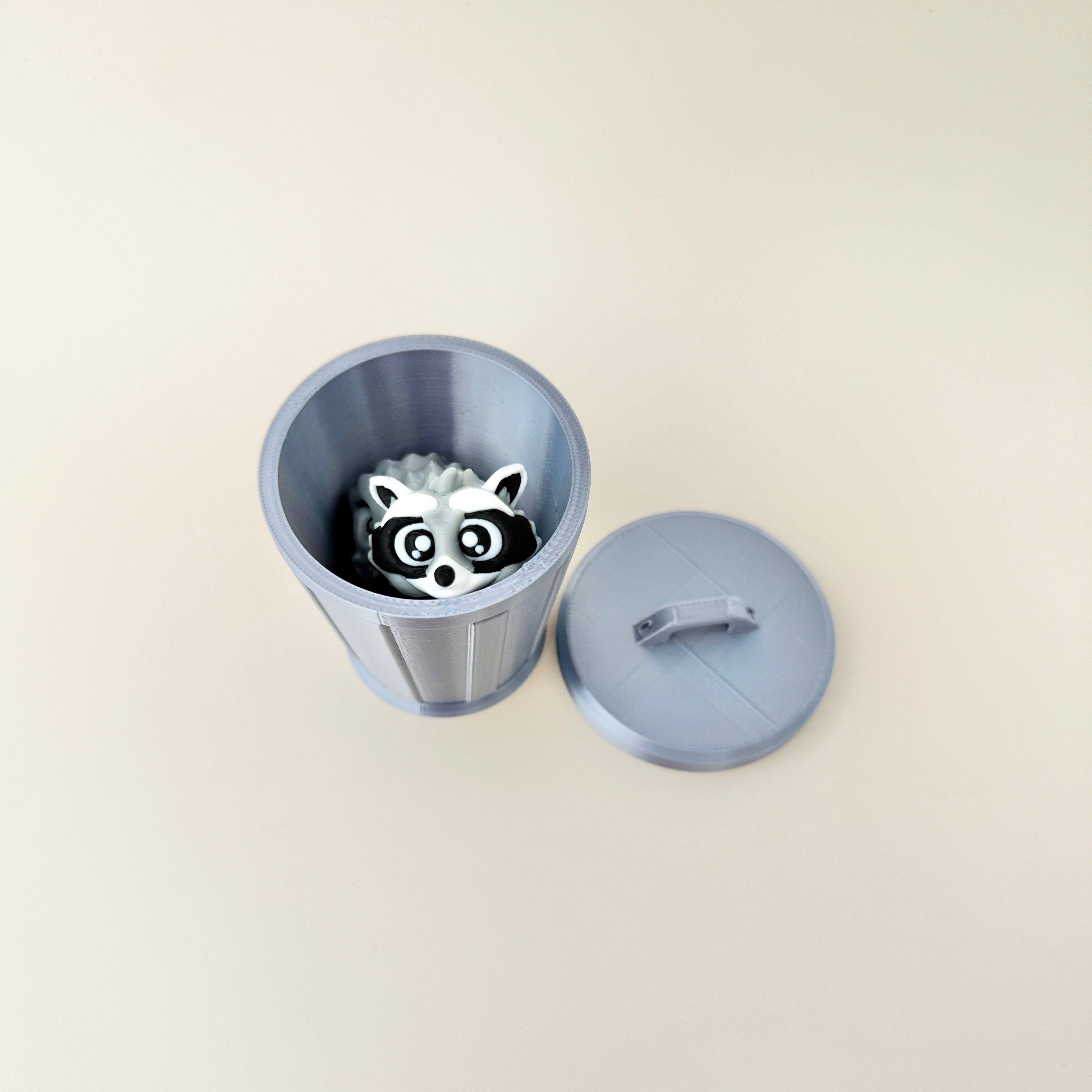 A detailed raccoon fidget toy with a flexible body, tail, and legs for tactile sensory play