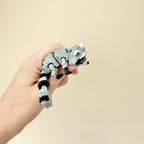 A unique fidget toy set featuring a raccoon and trash bin, great for sensory engagement and stress relief.