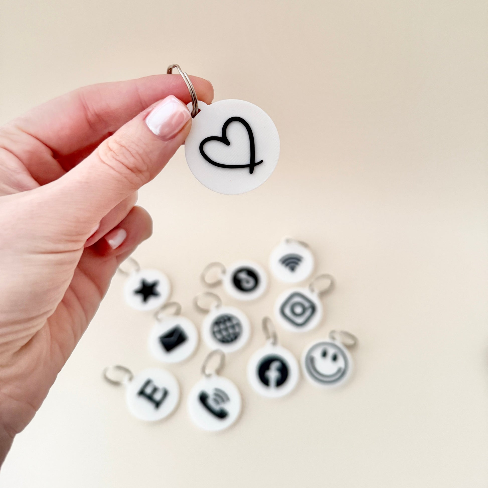 A set of NFC keyrings displayed on a table, highlighting their potential use for neurodiverse individuals and everyday practical applications.