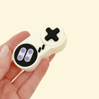A classic gaming-style fidget with two tactile clickers built into a handheld pad.