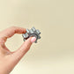 Ergonomic rim spinner with raised teeth for varied flicks and pinches; durable everyday carry size.