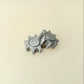 Small tactile spinner in cogwheel design; reliable low-noise spin for desk, class, or travel.
