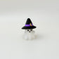 Mini ghost figure with a purple-banded hat and subtle tactile ridges for gentle fidgeting.
