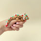 Hand-filling 13 cm fidget dragon for calm, rhythmic handling.
