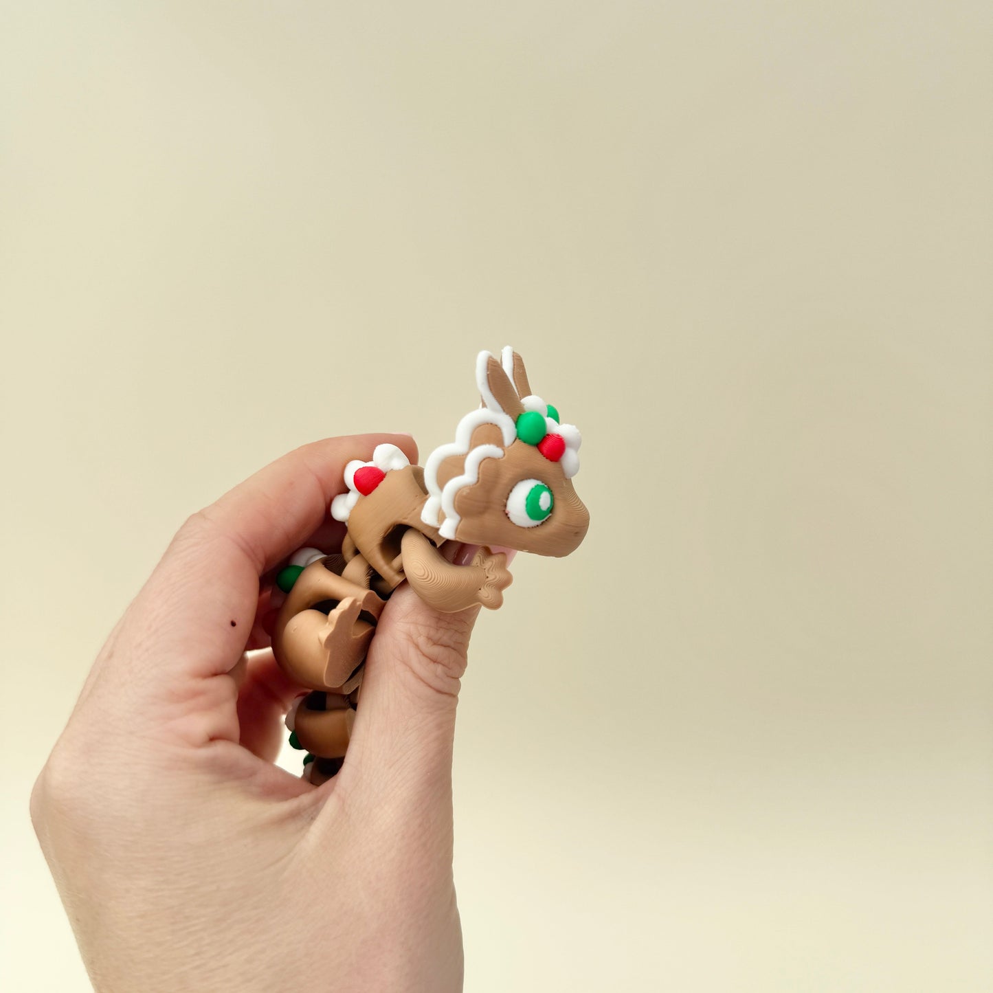 Gingerbread-style piping adds a playful holiday look to the dragon.
