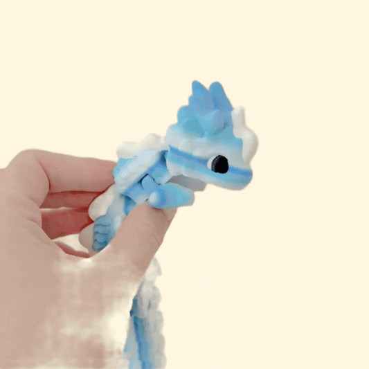 Smooth-flowing segmented body for calming stims; 3D-printed PLA; blue-white gradient; approx 25 cm long.
