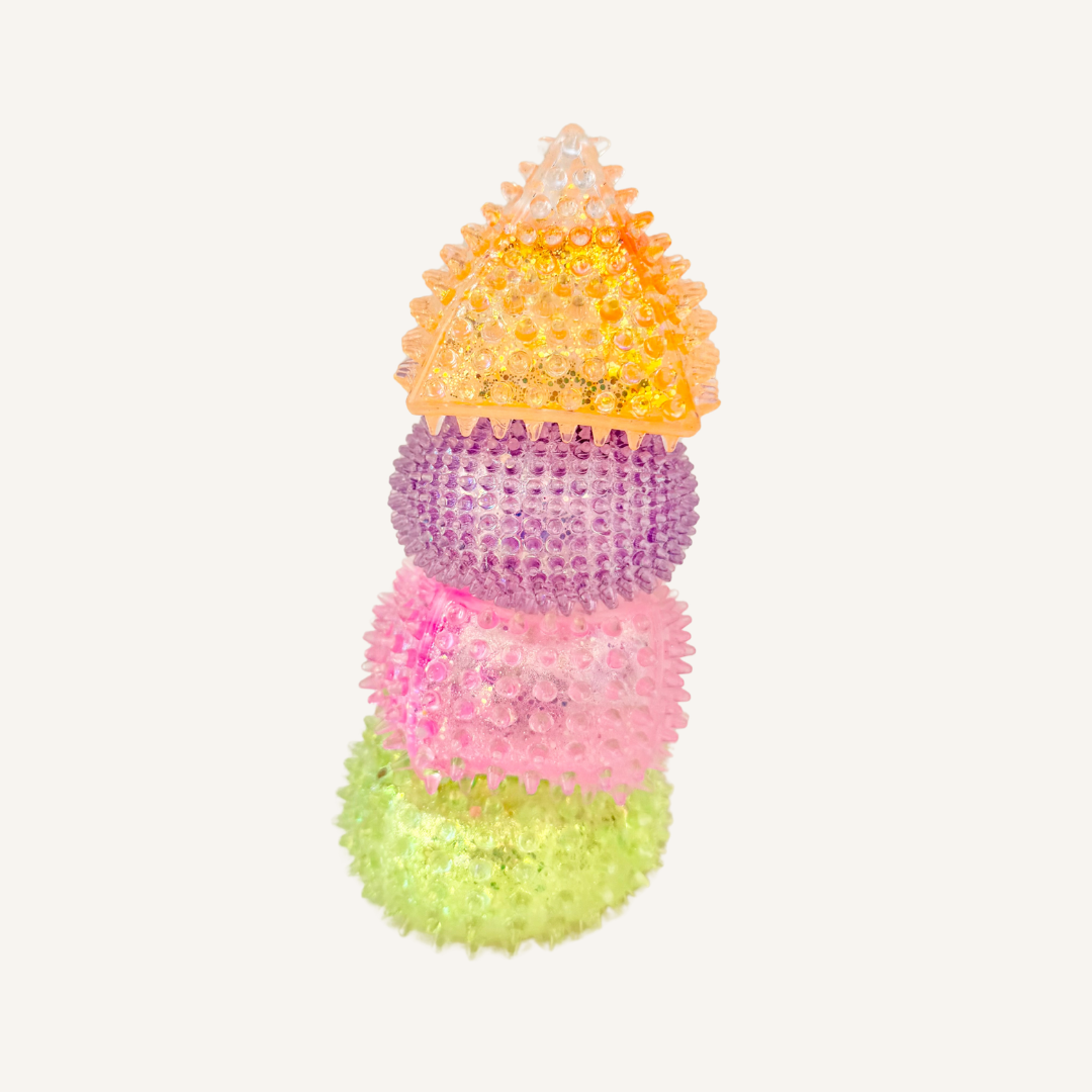 Sparkly textured squishy fidget with raised bumps for tracing, quiet sensory play and stress relief.
