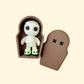 mini mummy figurine with glow slippers and a small coffin case for quiet sensory play
