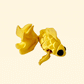Silk gold goldfish fidget toy with textured scales and movable fins, 9cm in length.