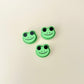 Small green frog fidget toy with a clicking feature, perfect for on-the-go fidgeting and stress relief.