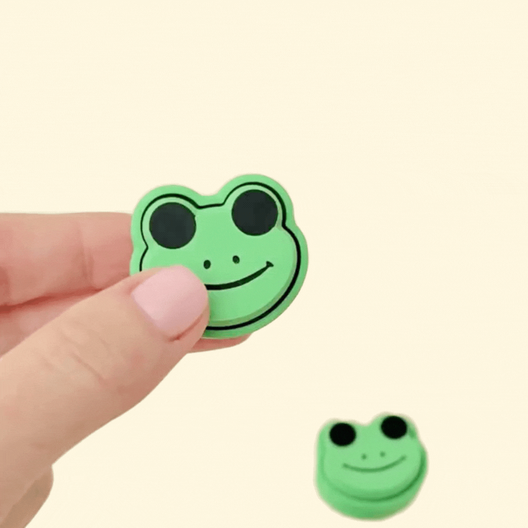 Compact frog clicker toy in green with tactile surface; designed for calming sensory input and fidget breaks.
