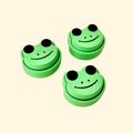 Small frog-shaped fidget clicker with raised textures and a smooth press for sensory play.
