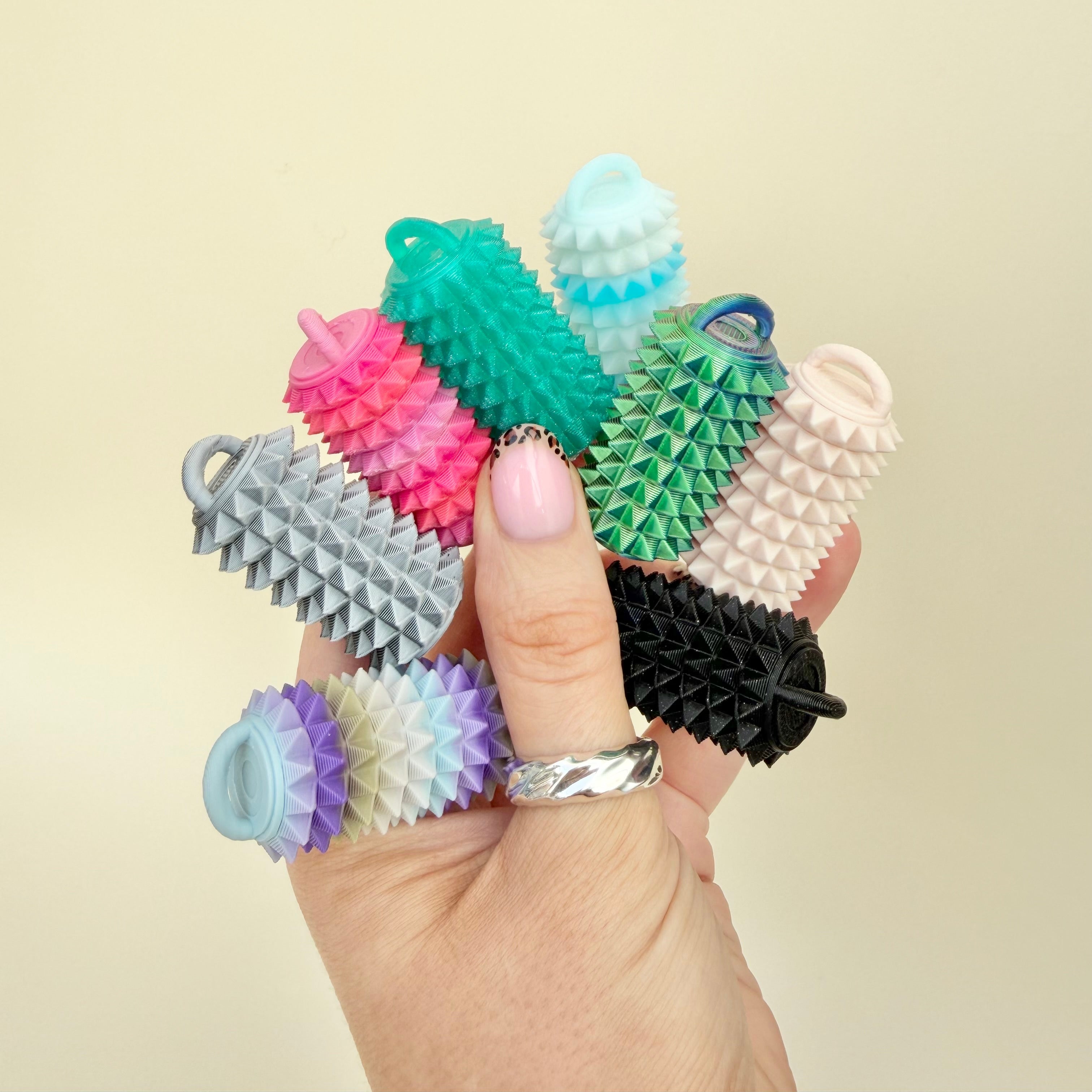 Portable textured roller fidget for deep pressure stimming and sensory regulation, lightweight and travel-friendly.
