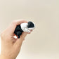 A realistic guinea pig fidget toy featuring articulated movement and a choice of black/white or ginger/white colour options.