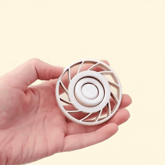 White-and-nude gyro spinner with blade-style spokes.
