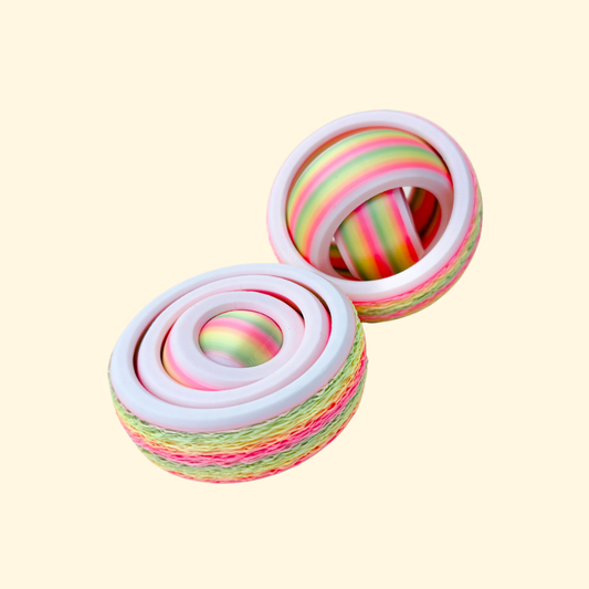 Four-ring gyro with a fuzzy outer rim and a quiet, balanced spin.
