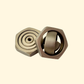 Metallic bronze hex-nut gyro spinner with quiet four-ring rotation.
