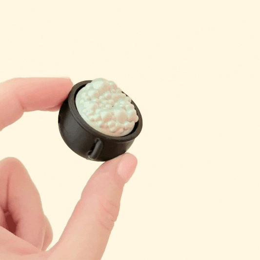 mini cauldron clicker toy designed for spooky sensory play
