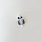 compact skeleton-themed clicker suitable for bags, keys and lanyards
