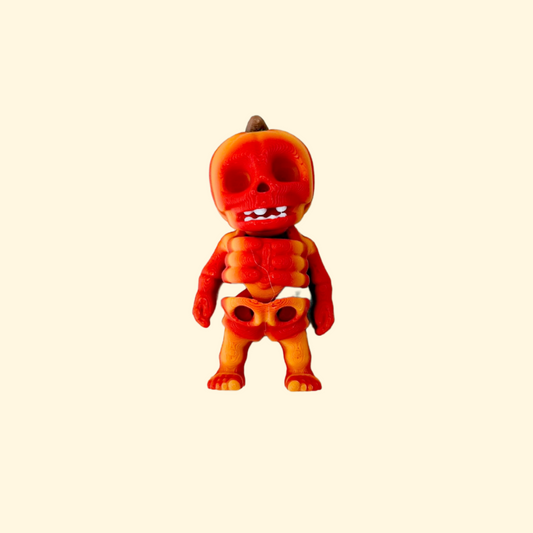 Small skeleton figure with pumpkin head and movable joints for sensory play
