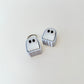 Compact ghost-shaped clicker with silver keyring loop
