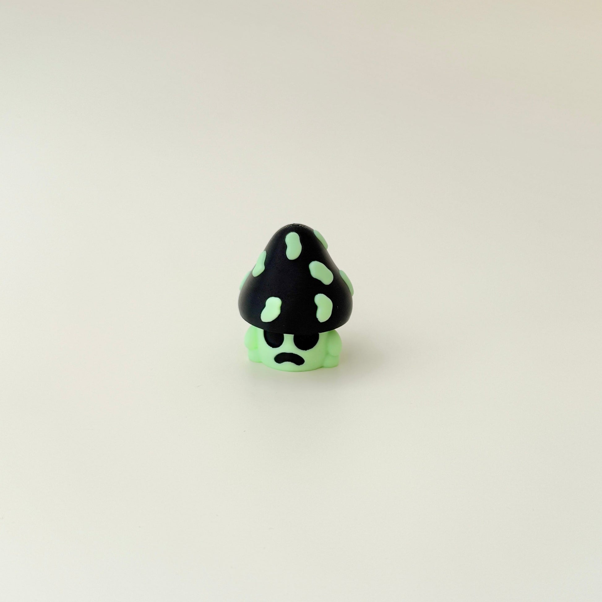 portable mushroom clicker featuring raised textures and a press-to-pop mechanism
