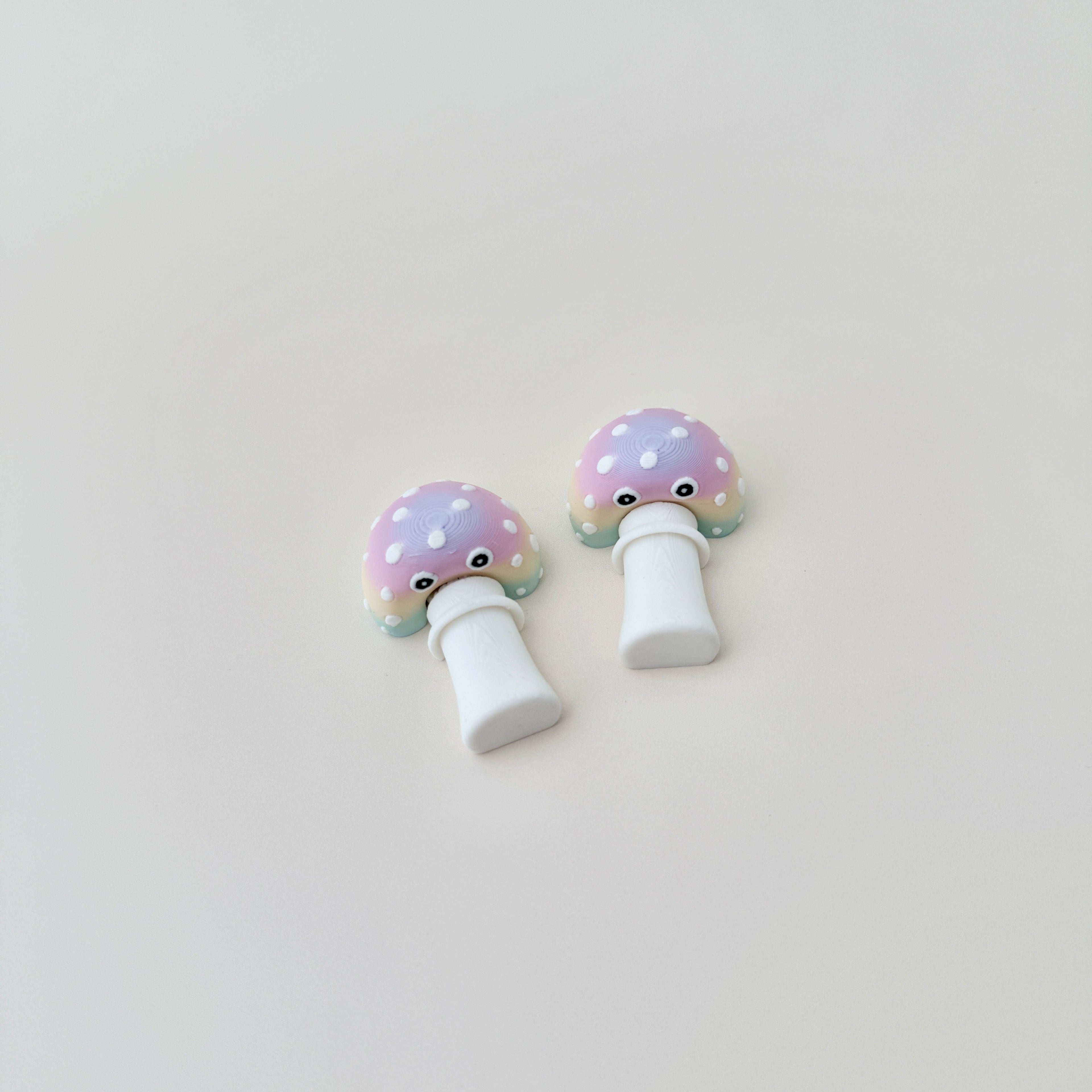 A quirky pocket-sized fidget designed for sensory play and stress relief.