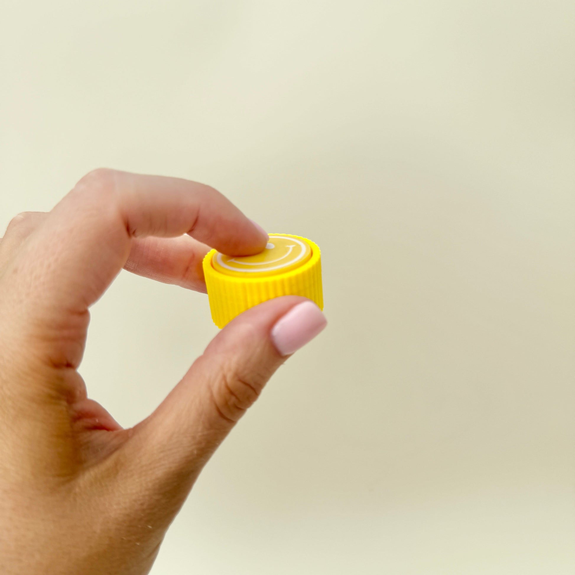 small handheld clicker designed for sensory stimming and focus
