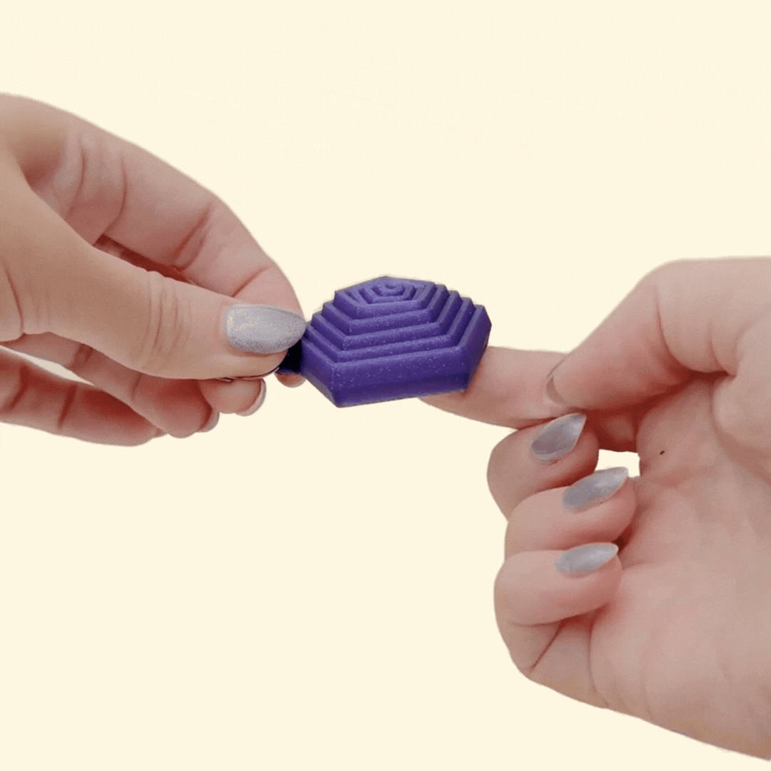 Small layered hexagon fidget with gentle movement for lanyards, great for visual stimming and tactile grounding.
