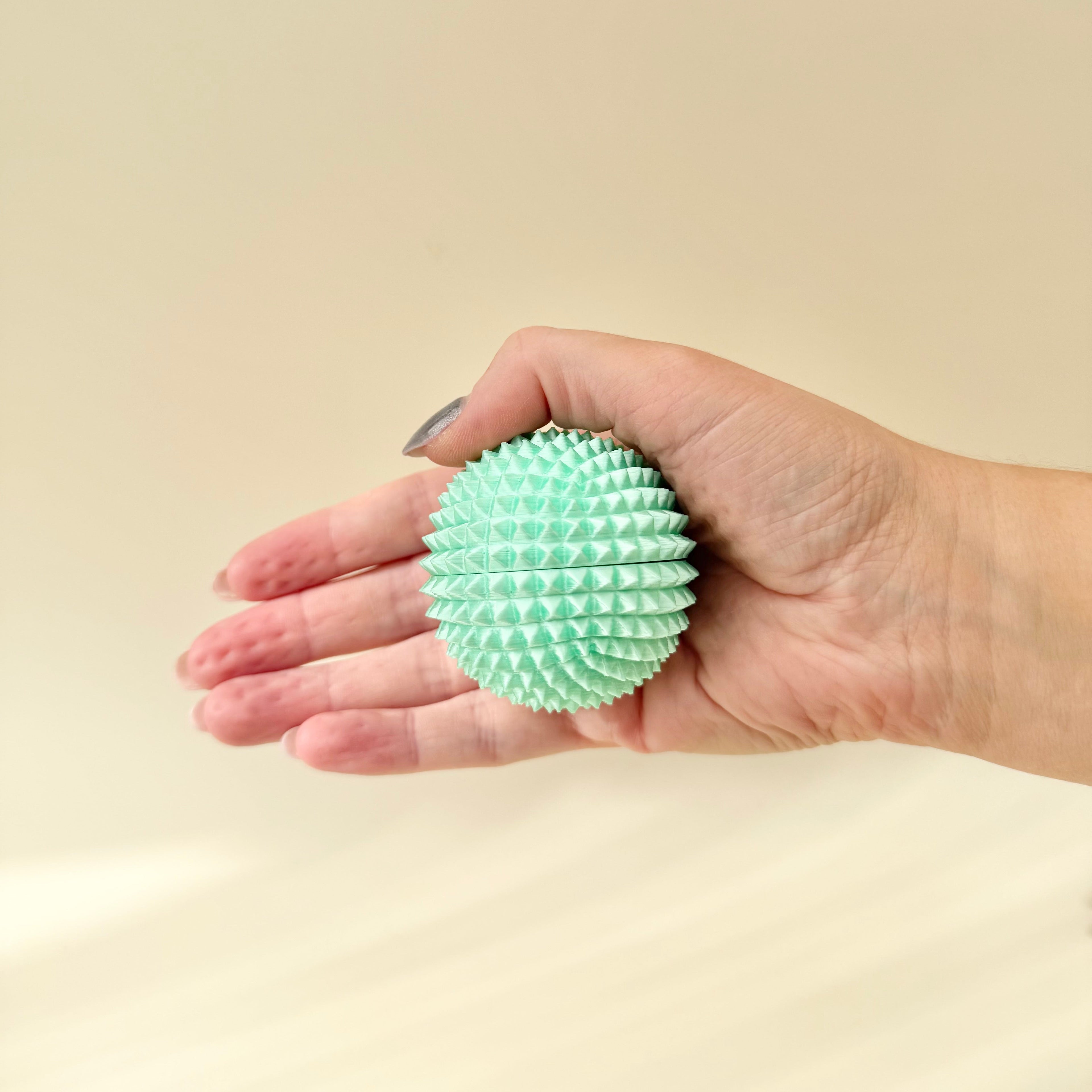 Structured tactile fidget designed for intense touch input, regulation and focus in a compact handheld size.
