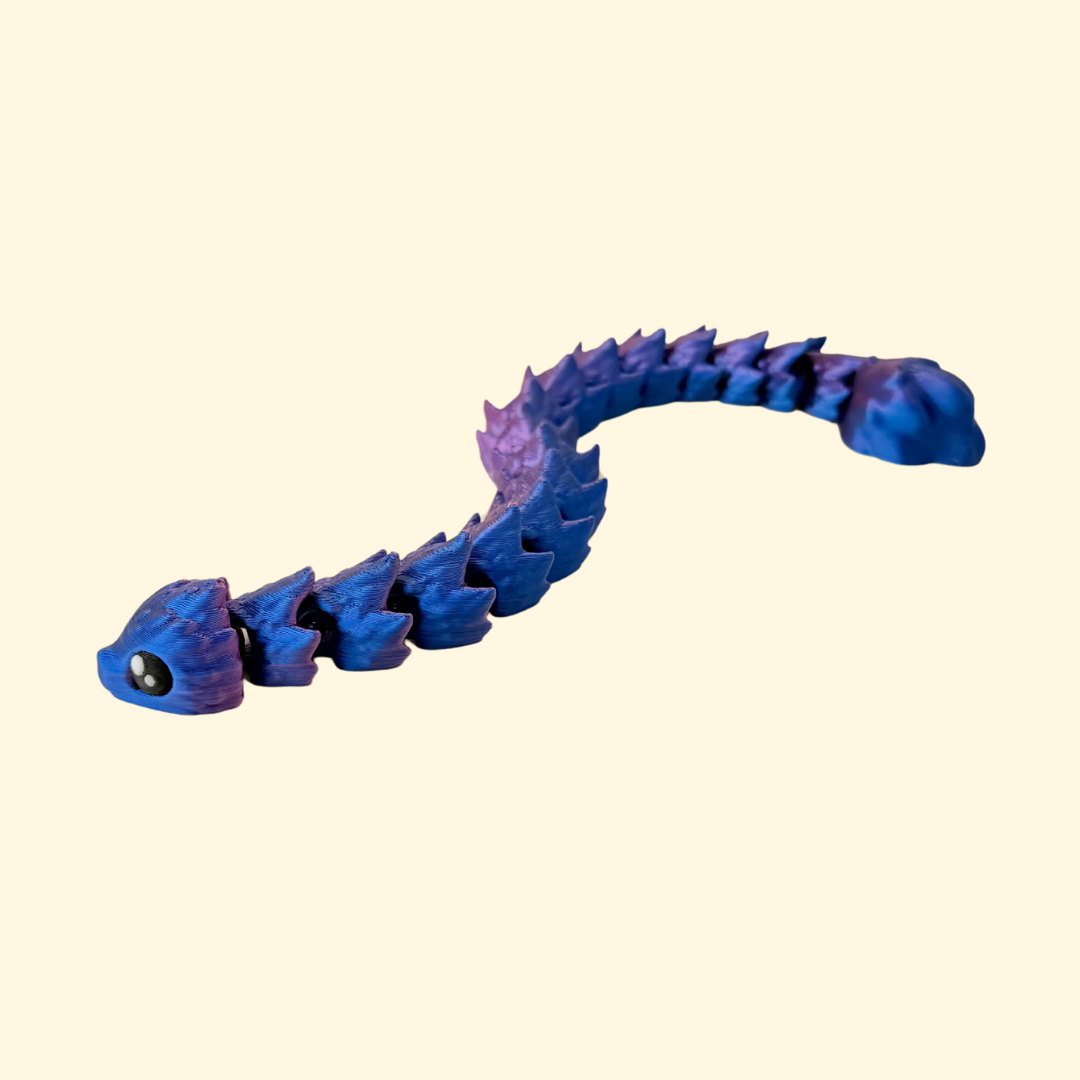 Textured, articulated snake fidget with colour-shifting finish for tactile sensory play.
