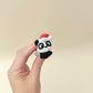 Cute articulated panda character for gentle sensory play and display.
