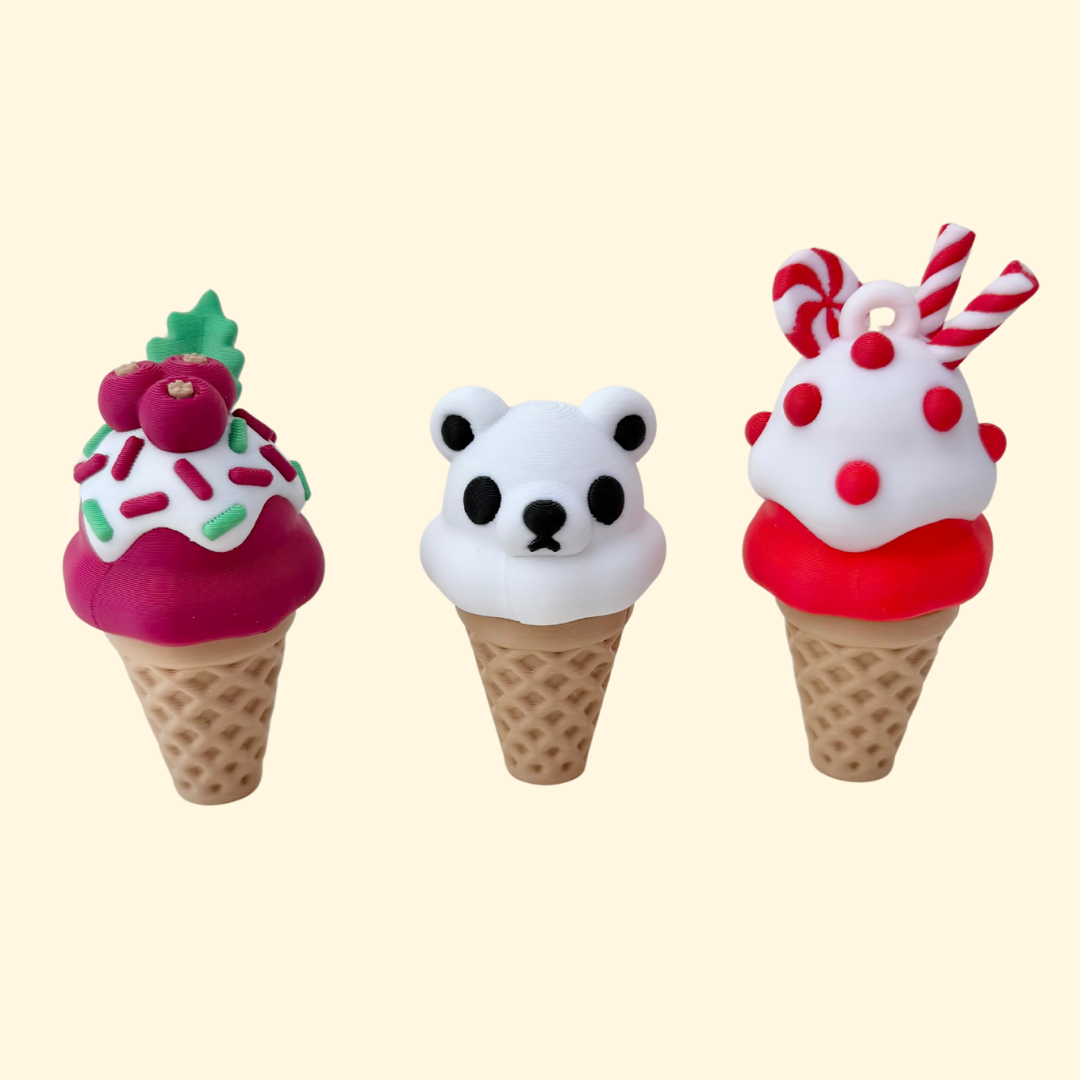 Christmas ice-cream cone clicker, 6–8 cm, textured cone with push-down top, chunky build for sensory fidgeting.
