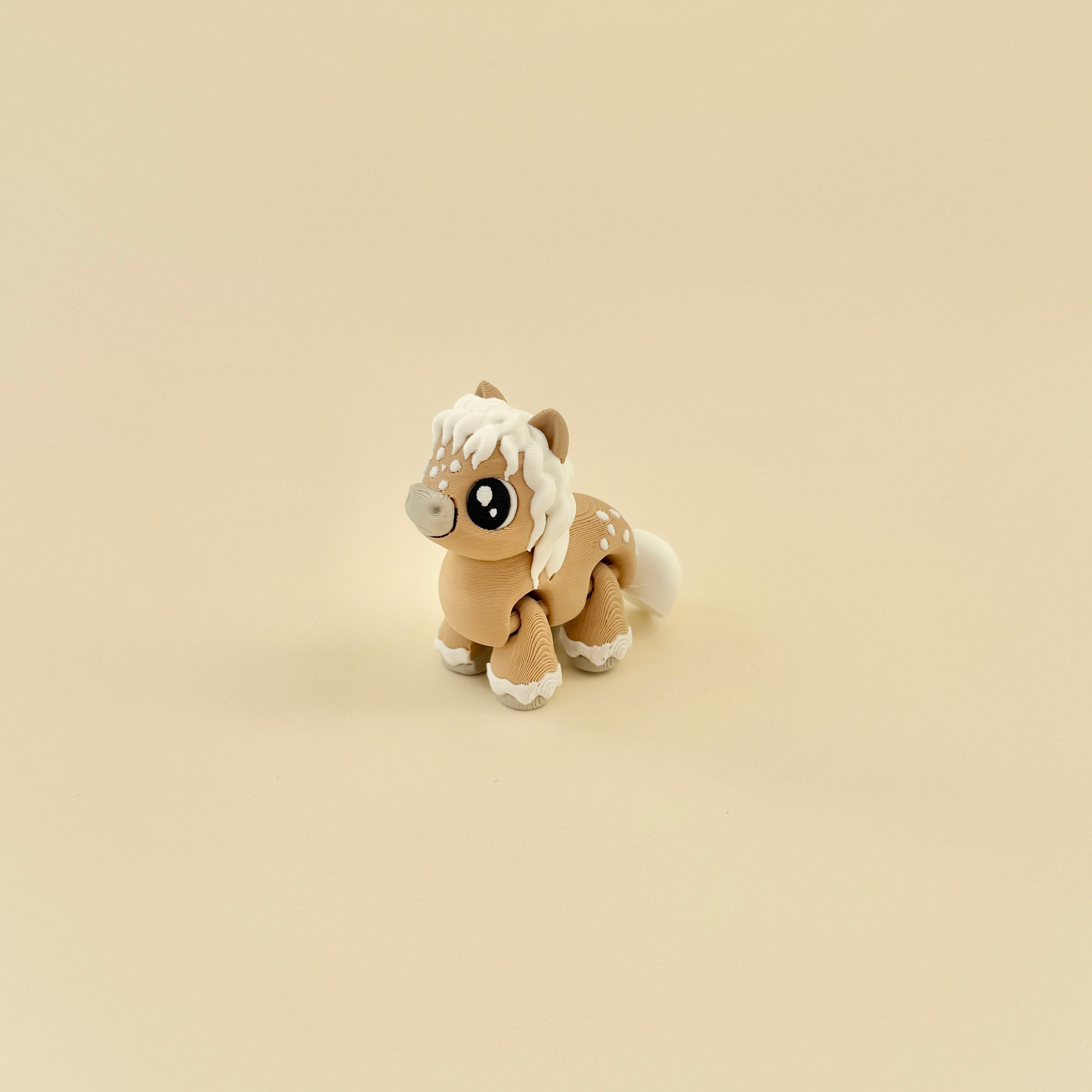 A cute, articulated horse fidget toy with big eyes and a cartoon-style design.