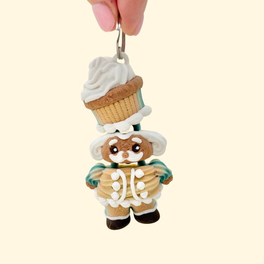A festive nutcracker keyring with raised icing-style details and a tactile bakery-inspired finish.
