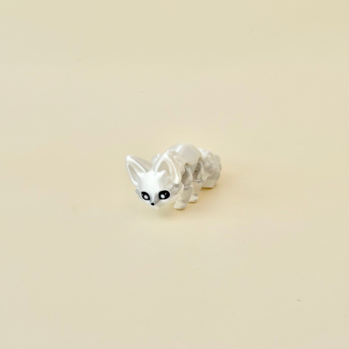 3D printed fox fidget in glossy white; lightweight, portable and satisfying to manipulate.
